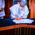 Excitement As President Buhari Signs Powerful Document Into Law