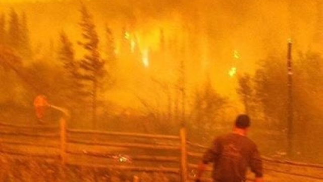 Several dozen people in the tiny community of Riske Creek, B.C., have taken matters into their own hands and are working to protect their properties from wildfire, 22 July 2017. Photo: Evan Fuller / CBC News