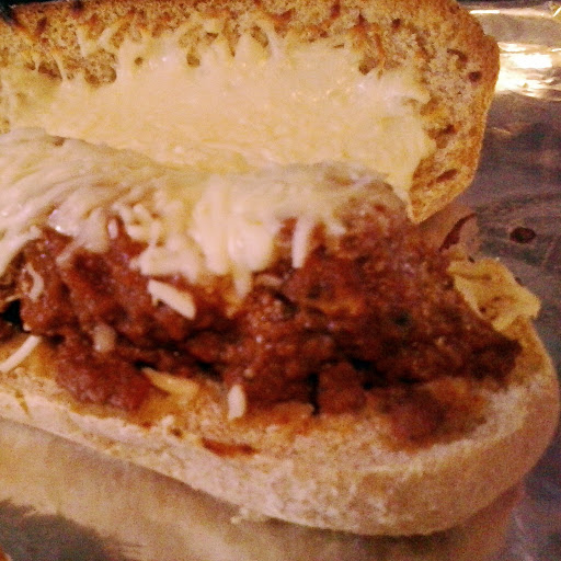 Meatball Sub:  Way better than subway.  This Meatball Sub is the third meal made from my Slow Cooker Meatballs in a Whole Wheat Italian roll smothered in cheese.