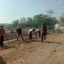 Serma Rusmani Babinsa Bermi Bergotong Royong Bersama Warga Bersihkan Badan Jalan
