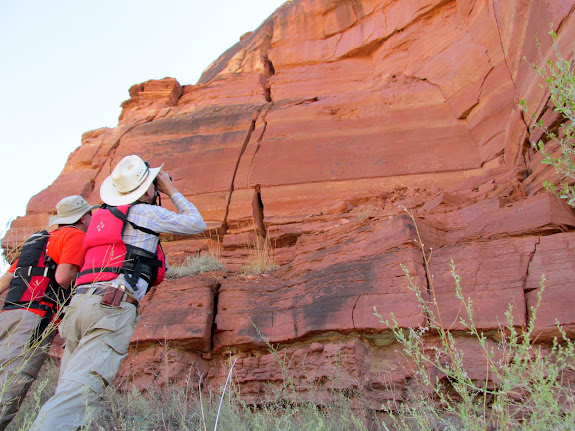 Peering up at a painted inscription