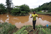 Sakhi Mabhayi explains how the river flooded and damaged homes in Peace Valley.