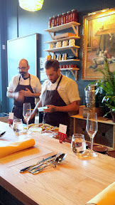 Inside of Farm Spirit, at seating. Chef Ricardo welcomes us at the door and explains the beverage program while Chef Tim is on the final prep of the first course.