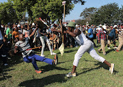 A fighter falls to the ground.  