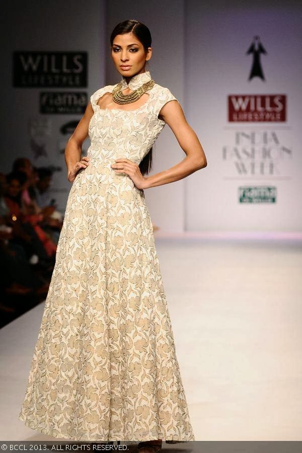 Donna displays a creation by fashion designer Vedangi Agarwal on Day 5 of Wills Lifestyle India Fashion Week (WIFW) Spring/Summer 2014, held in Delhi.