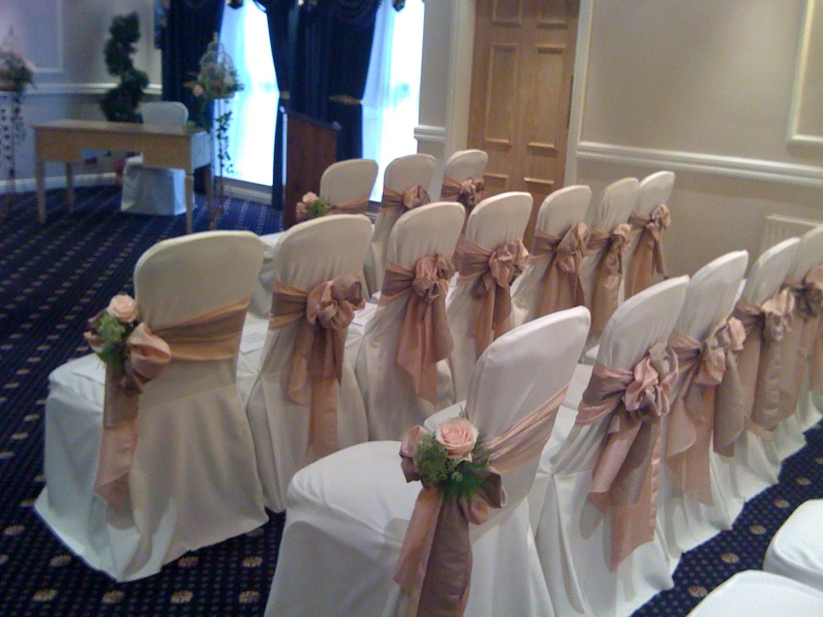 navy sashes in the wedding breakfast room. My table centrepieces are