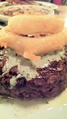 Laurelhurst Market delectable Brandt Ribeye Cold Smoked with Blue Cheese Butter and Fried Sweet Onion Rings