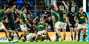 Springboks players celebrate after winning the match.