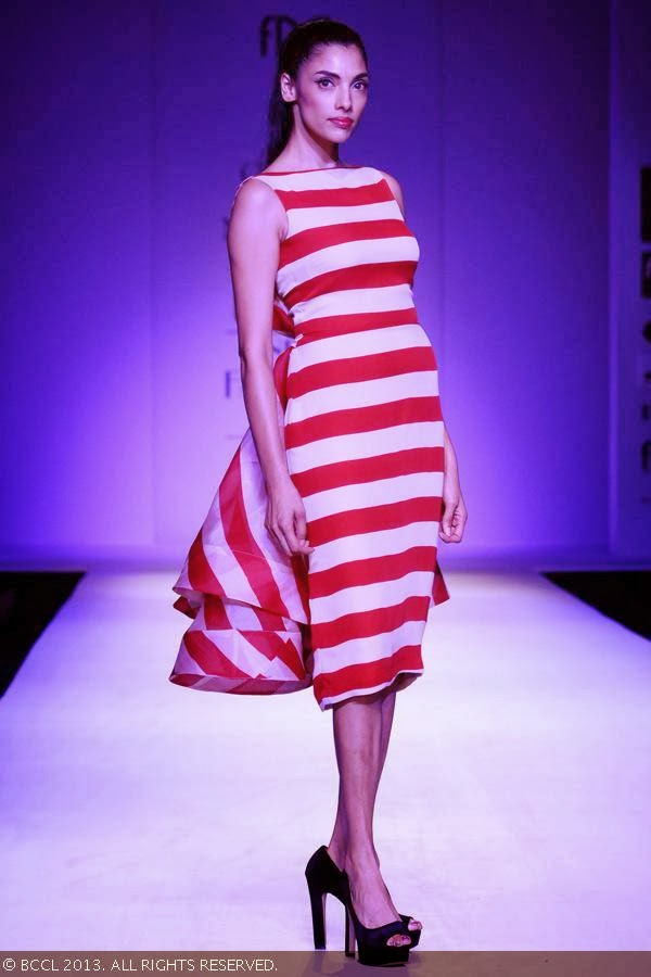 Indrani Dasgupta walks the ramp for fashion designers Gauri and Nainika on Day 1 of the Wills Lifestyle India Fashion Week (WIFW) Spring/Summer 2014, held in Delhi.