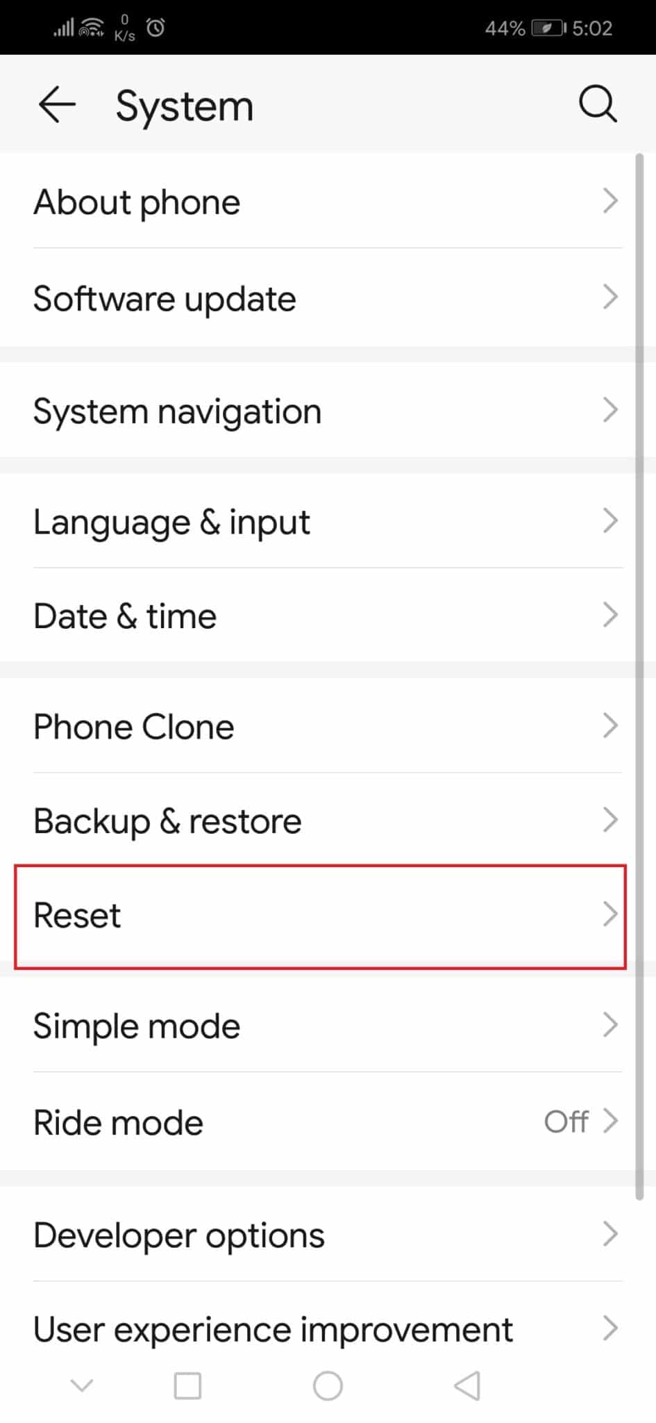 toque la opción Restablecer en Configuración del sistema