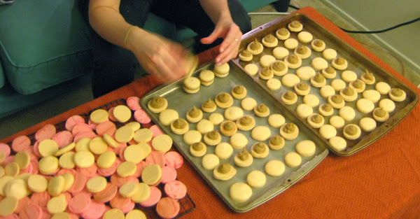 Filling the pumpkin macarons