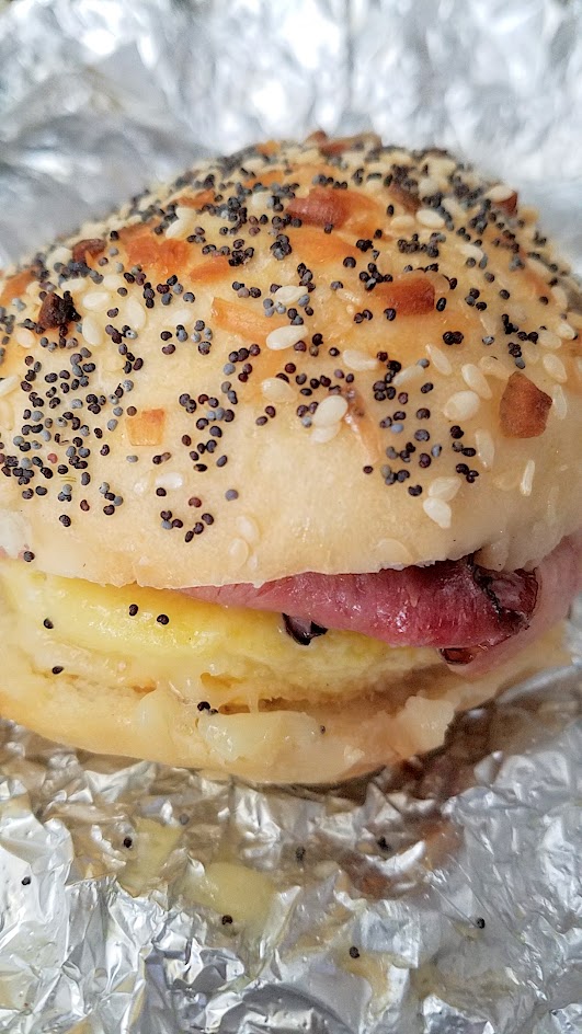 Roman Candle Baking Company breakfast fun with their breakfast bun, an Everything Bun, available 7 AM - 1 PM