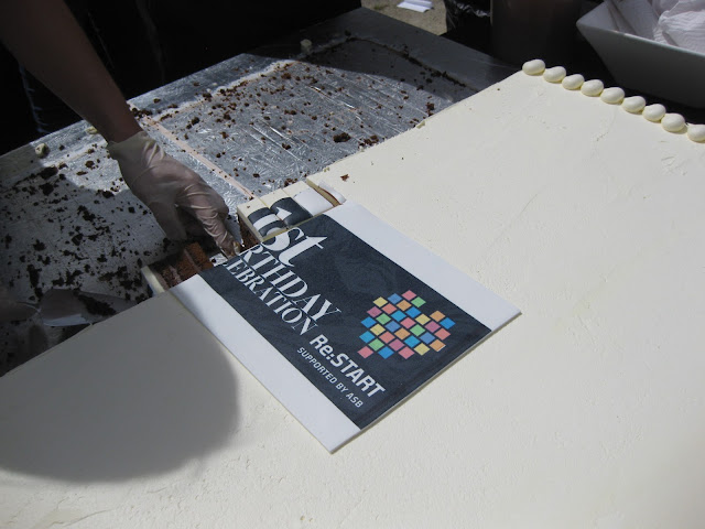 A slice of cake in exchange for a charitable donation, at Ballantyne's where the first anniversary of the Re:Start Cashel Mall was celebrated at the end of October.