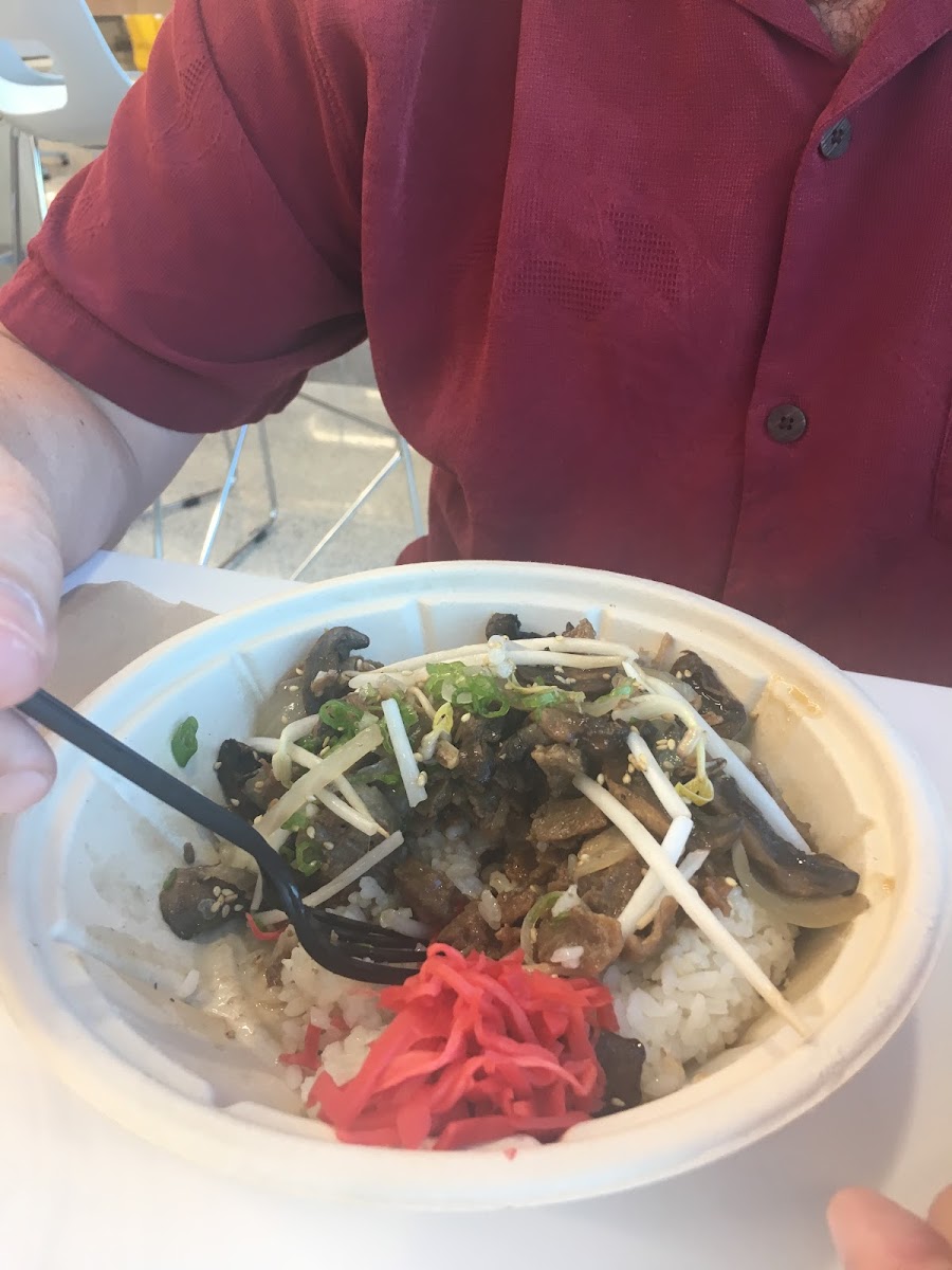 Teri beef bowl with rice, ginger, bean sprouts, scallions, onions, mushrooms, and sesame seeds