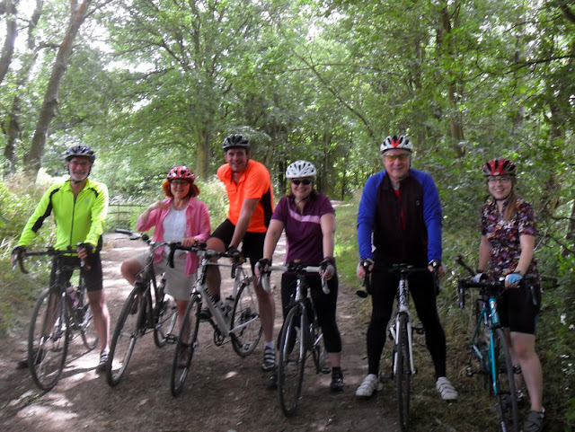 row of happy cyclists