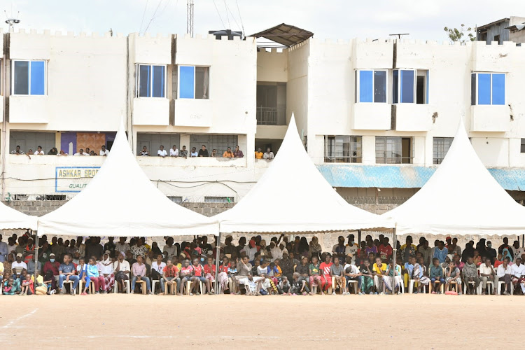 Residents of Garissa follow events at Garissa primary during mashujaa day celebrations.