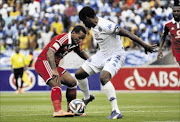 NO HOLDING BACK: Kermit Erasmus of Orlando Pirates, left, is confronted by  Thabo September of SuperSport United during Sunday's Absa Premiership match  Photo: Philip Maeta/Gallo Images