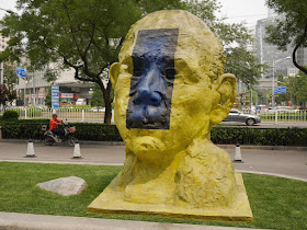 "Yellow Sculpture" from "Three For You" by Gianni Dessi in front of the Parkview Green in Beijing