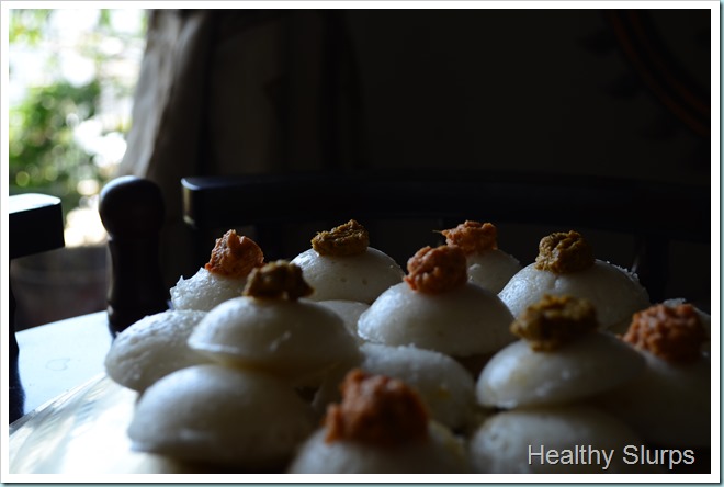 Idli topped with two chutneys