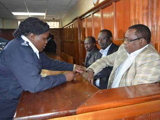 Agriculture PS Richard Lesiyampe (C), ex-NCPB Managing Director Newton Terer (R) and former general manager finance Cornel Kiprotich at the Milimani law court on Thursday, August 30, 2018. /COLLINS KWEYU