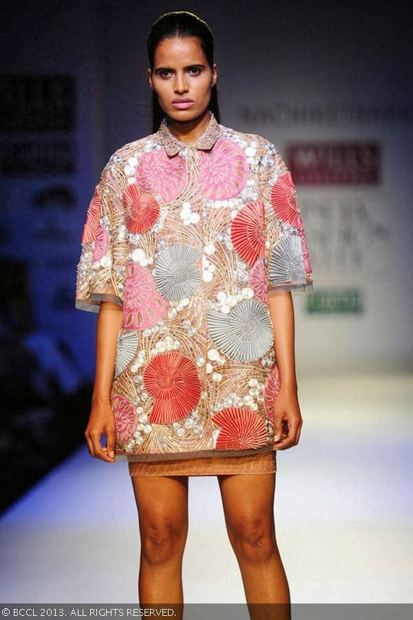 A model walks the ramp for fashion designer Nachiket Barve on Day 1 of the Wills Lifestyle India Fashion Week (WIFW) Spring/Summer 2014, held in Delhi.