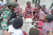 Peduli Terhadap Sesama, Satgas Yonif Raider 321/GT/13/1 Kostrad Bagikan Bubur Kacang Hijau