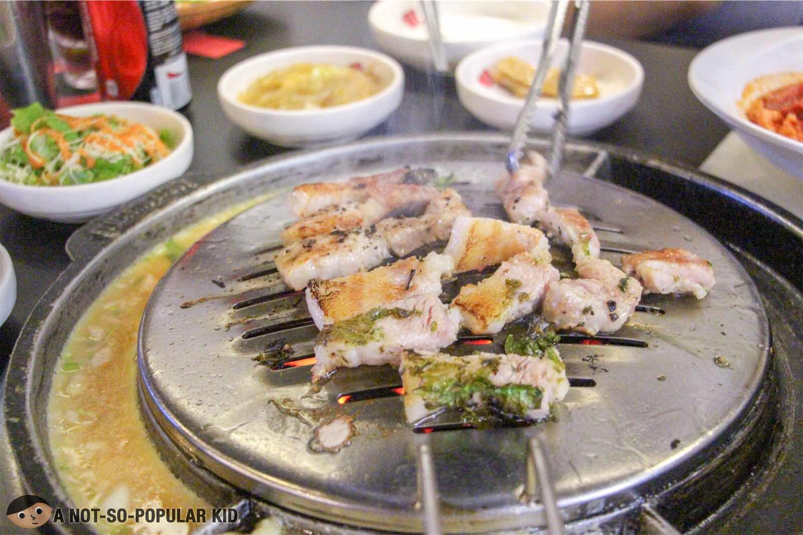 Golden brown samgyupsal (cooked) in Romantic Baboy