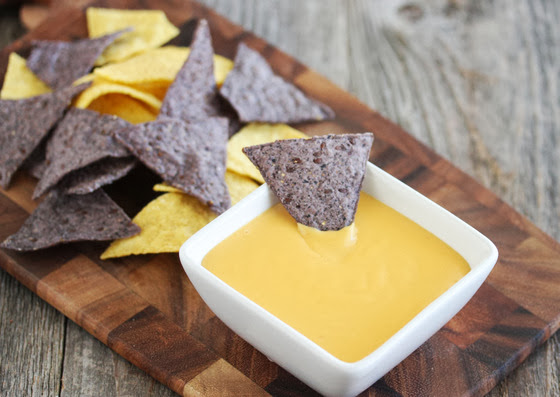 photo of a bowl of cheese dip with tortilla chips