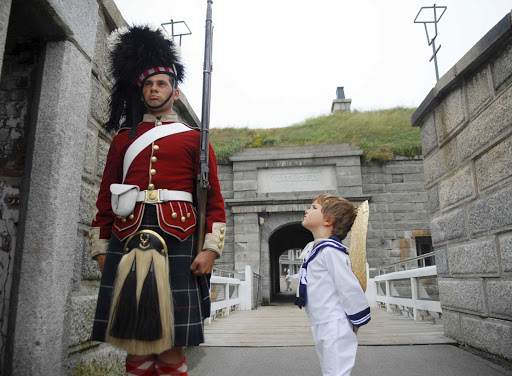  A young sailor inspects a guard at the Halifax Citadel. 