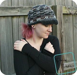 gray, black and brown newsboy cap worn by woman standing in front of wooden fence