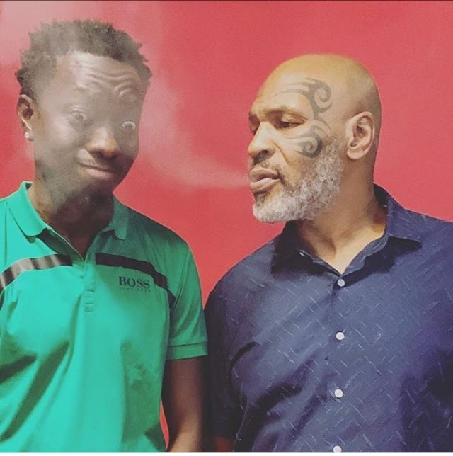 Michael Blackson pictured with Mike Tyson after he jokingly indicated interest in marrying his daughter for $10 million reward