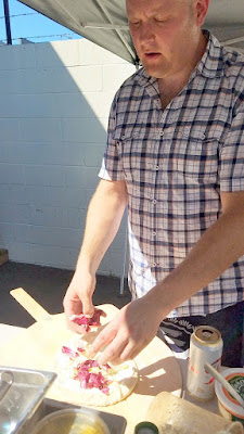 After 10 years of perfecting, the homemade sourdough pizza dough of Paul Willenberg finally made it's public debut for a Seafood Pizza Sunday at Teutonic Winery on July 24th. Here Paul is preparing Pizza alla Bagna Cauda Fennel and Radicchio on a base of blended Sicilian Anchovies, Butter, Olive Oil, Garlic and Crushed Red Pepper