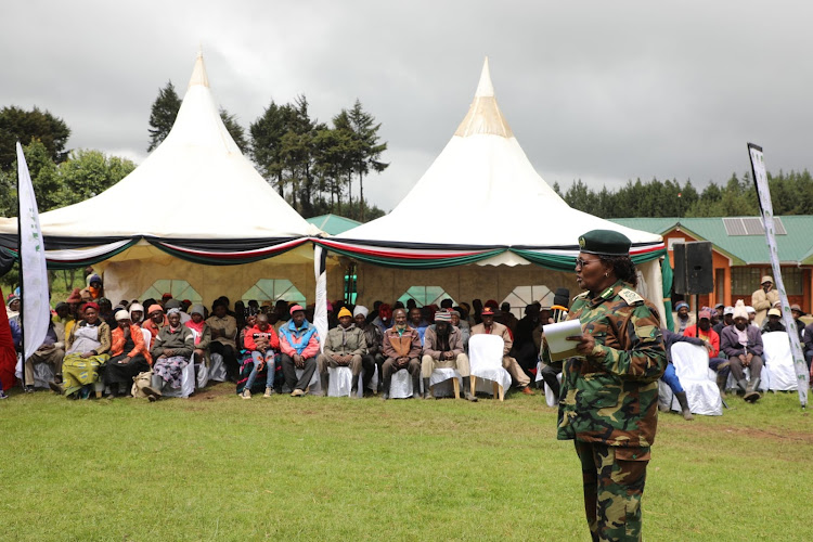 KFS deputy chief conservator of forests Beatrice Mbula addressing community forest associations at Kinale forest