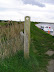 Angles Way Waymarker some useful markers on this route including how many miles to the next pub!