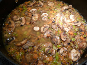 making chicken fricassee, adding wine and water and beginning the stew part