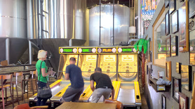 Oskar Blues Tasting Room the Tasty Weasel - a small room on the left gives you a glimpse of the canning production plus skeeball and seating for drinking your beer