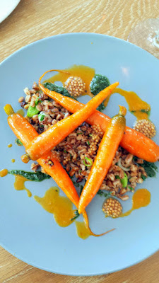 Glyph Café & Art Space Whole Vegetable Special of Carrots with Heirloom Carrots in a carrot emulsion, carrot top pesto, salted green garlic and toasted farro