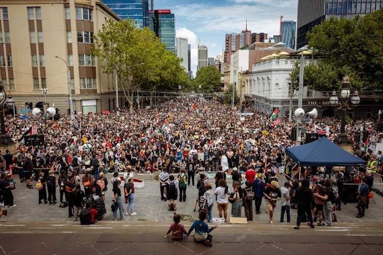 Crowds that gathered on the steps of the Victorian Parliament for the Invasion Day Rally on January 26, 2024 in Melbourne, Australia. Australia Day, formerly known as Foundation Day, is the official national day of Australia and is celebrated annually on January 26 to commemorate the arrival of the First Fleet to Sydney in 1788.