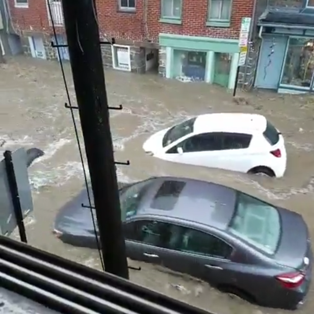 Floodwaters carry cars down the street in Ellicott City, Maryland, 27 May 2018. Photo: Craig Patrick / Instagram