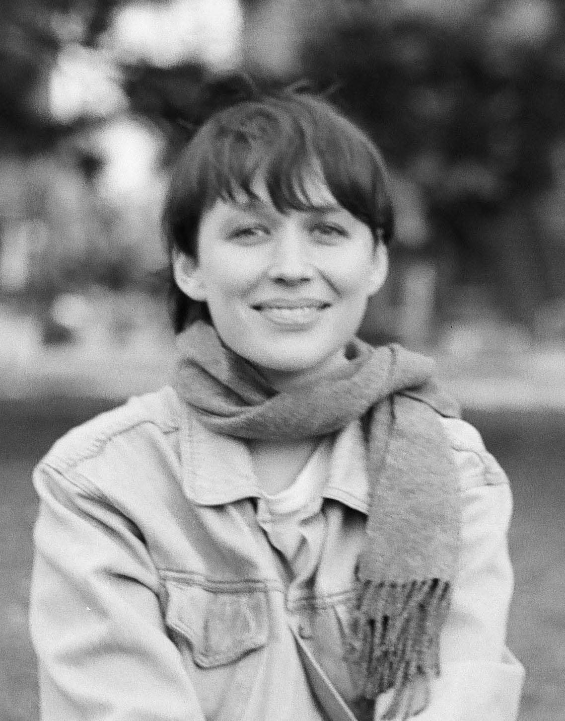 A black and white image of Katrin Rohrbacher smiling 