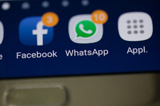 Picture of the WhatsApp icon on the screen of a mobile phone