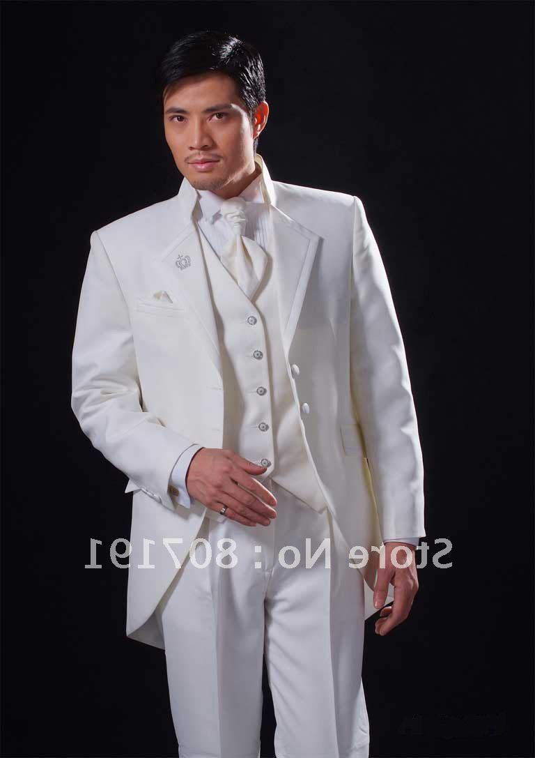 grooms white wedding attire