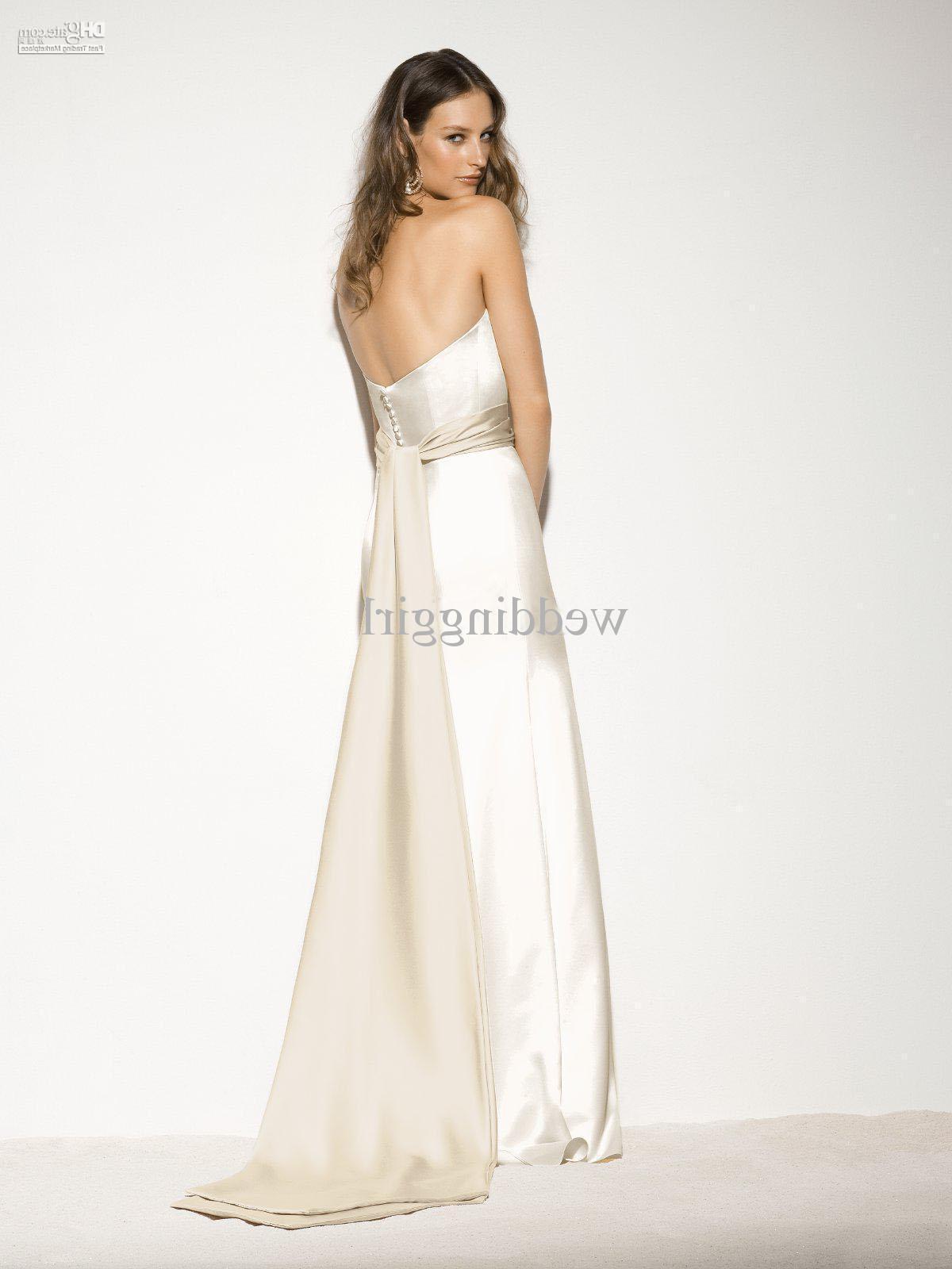 V-neck mermaid slhouette lace gown with satin bow and jeweled detail on