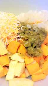 Toss together your squash, cheese, green chlies, chopped onions, and flour for the first step of the Recipe for a Vegetarian Southwest Squash Casserole