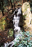 Waterfall outside buddhist temple, Kyoto, Japan.