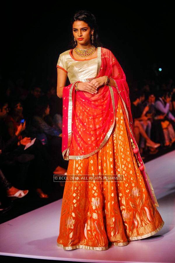 A model walks the ramp for Mahabir & KIK Jewells on Day 3 of India International Jewellery Week (IIJW), 2014, held at Grand Hyatt, in Mumbai.  