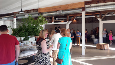 The mingling of guests while enjoying a glass of Brooks Winery white during the First course of passed hors d'oeuvres at the Jacobsen Salt Co Salt Fire Water dinner #3 with Ivan Ramen + Lang Baan