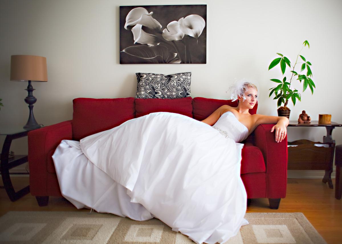 Bride on her cheap red couch