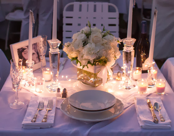 close-up of a place setting lit with candles