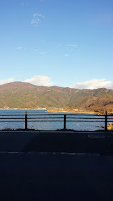 At our ryokan Wakakusa no Yado Maruei, after checking in at the front desk they took us to a room that seemed like an empty cafe with tables and chairs, and sat us at a table with a view of Lake Kawaguchiko to welcome us with tea and a tea snack